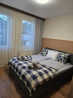 a bedroom with a bed with two pillows on it at IG Apartments Royal Towers 426 in Bansko