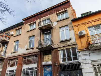 an old building with windows and balconies on it at Lion's Bridge Haven - Sofia Central Studio in Sofia