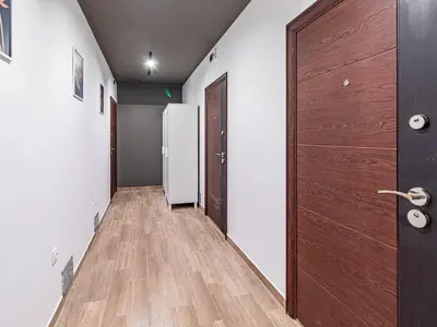 an empty hallway with a door and a refrigerator at Vitosha Loft - Central Sofia Studio in Sofia