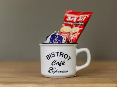 a coffee cup filled with some food and snacks at Vitosha Loft - Central Sofia Studio in Sofia