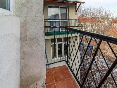 a balcony of a building with a window and a railing at Largo Loft - Central Sofia Studio in Sofia
