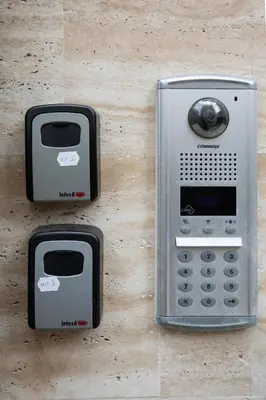 a close up of a pay phone on a wall at Didi's Central Designer Apartments in Sofia