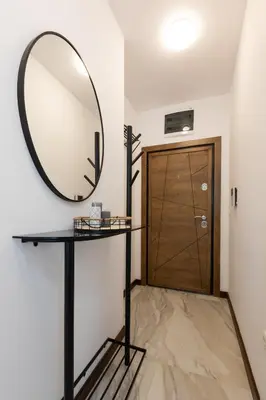 a mirror on a table next to a door at Didi's Central Designer Apartments in Sofia