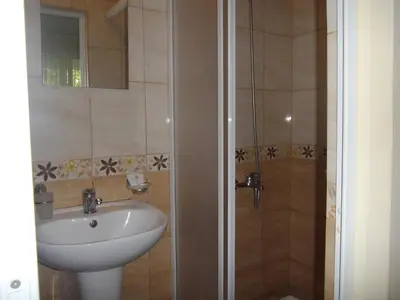 a bathroom with a sink and a shower at Sakutski House in Hisarya
