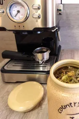 a coffee maker with a cup of coffee on a counter at Bansko Ski & Relax Apartment in Bansko