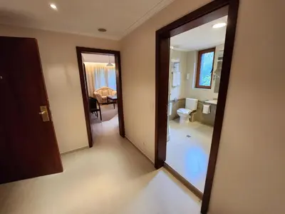 an open door to a room with a bathroom at Luxury Downtown Appartment - 150m ski lift Gondola in Bansko