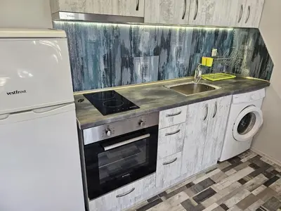 a kitchen with a sink and a stove top oven at Studio Apartament 47А- Trakia 54 А in Plovdiv