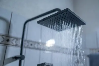 a shower head with water pouring out of it at Vintage Home by NDK and Vitosha Blvd with Free Secured Parking in Sofia