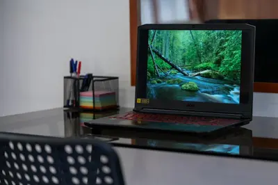 a laptop computer sitting on top of a glass table at Vintage Home by NDK and Vitosha Blvd with Free Secured Parking in Sofia