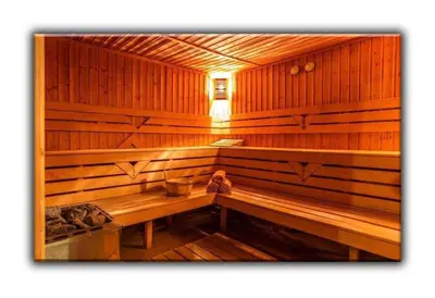 a wooden sauna with a bench in it at Teo and Miki 612 in Pamporovo