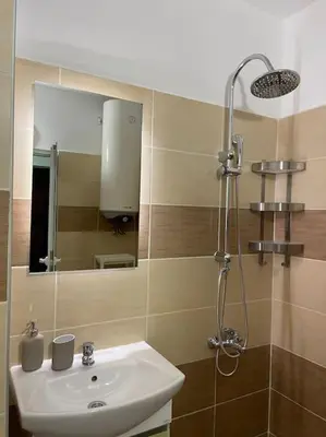 a bathroom with a sink and a mirror at Sweet Studio Office & Amazing Coffee in Sofia