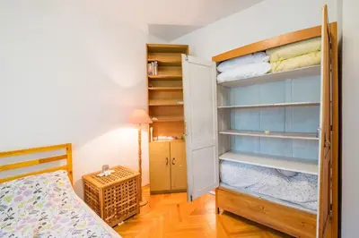 a bedroom with a bed and a bunk bed at Beautiful Flat in Central Location by Flat Mаnager in Sofia