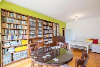 a living room with a table and some books at Beautiful Flat in Central Location by Flat Mаnager in Sofia