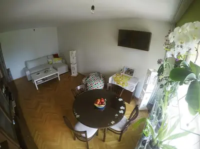 a living room with a table and chairs and a couch at Beautiful Flat in Central Location by Flat Mаnager in Sofia