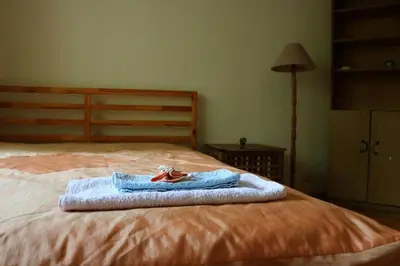 a pair of shoes sitting on top of a bed at Beautiful Flat in Central Location by Flat Mаnager in Sofia