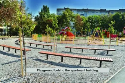 a playground with a playground behind the apartment building at Beautiful Flat in Central Location by Flat Mаnager in Sofia