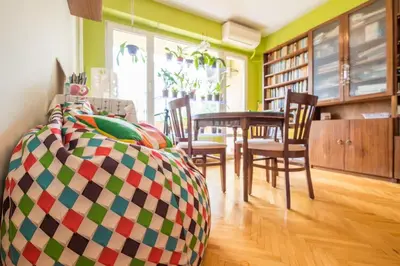 a room with a table and chairs and a dining room at Beautiful Flat in Central Location by Flat Mаnager in Sofia