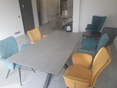a conference table and chairs with a table and chairsktop at Димоти Апартхотел in Sofia