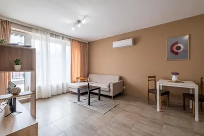 a living room with a couch and a table at Cozy Homes 3 in Sofia