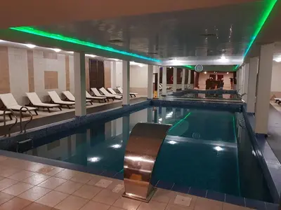 a pool with a pool table in a building at Spacious luxury studio with mountain view - SPA available in Bansko