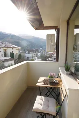 a small balcony with a table and a view at View in Petrich