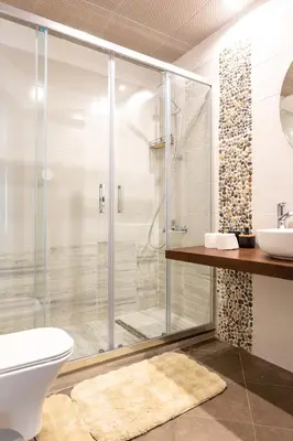 a bathroom with a shower and a toilet and a sink at Bansko Getaway- Ski & Summer Activities , sleep 6 in Bansko