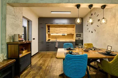 a kitchen and dining room with a table and chairs at Luxury 2 Bedroom Apartment - Private Garden in Sofia