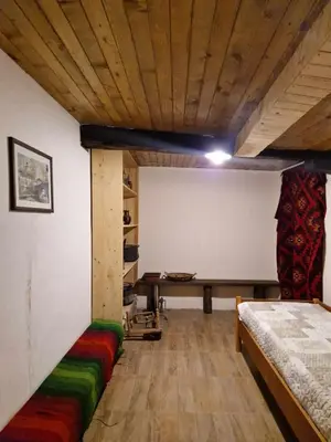 a room with a bed and a table in it at Vila Anna in Ribarica