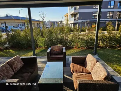 two couches and a coffee table on a patio at Dilyanka in Pernik