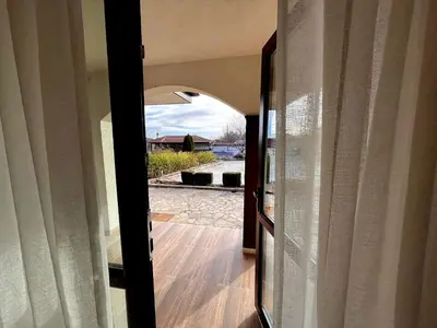 an open door to a house with a view at Entheos in Vŭrben