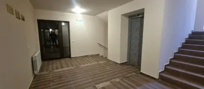 an empty room with a staircase and a door at Borovets gardens Studio A12 in Borovets