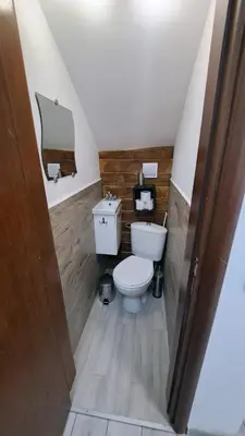 a bathroom with a toilet and a sink at Very cozy and comfort house in top location in Bansko