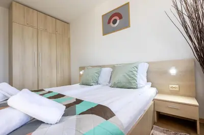 a bedroom with two beds and a cabinet at Mountain Escape & View & Relax in Bansko