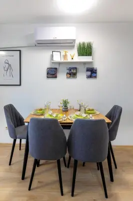 a dining room with a table and chairs at Mountain Escape & View & Relax in Bansko