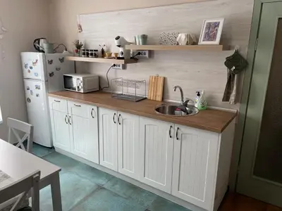 a kitchen with a sink and a white refrigerator at NiDo Cozy 3BR Apartment Kapana Top Center in Plovdiv