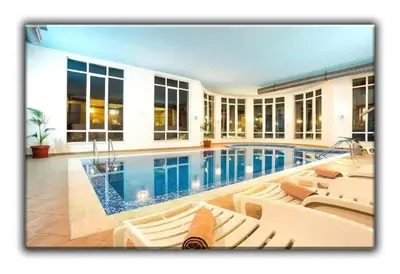 a house with a swimming pool with white furniture at 705 in The Stream Resort in Pamporovo