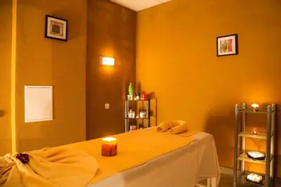 a room with a bed with a candle on it at 705 in The Stream Resort in Pamporovo