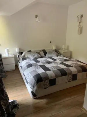 a bedroom with a black and white checkered bed at 705 in The Stream Resort in Pamporovo