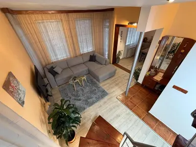 an overhead view of a living room with a couch at The Maisonette in Sofia's Heart in Sofia