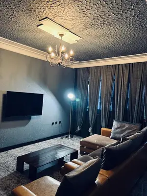 a living room with a couch and a table at Central Apartment Black Cat in Karlovo