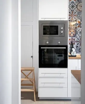 a kitchen with a microwave and a stove at Bohemian Central Apartment Sofia in Sofia