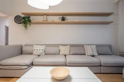 a living room with a couch and a table at The Griffin in Sofia