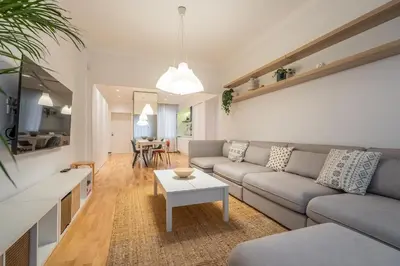a living room with a couch and a table at The Griffin in Sofia
