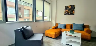 a living room with a couch and a chair at Flower home 11 in Sofia