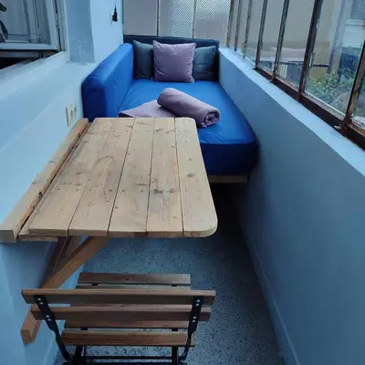 a table and a couch in a room with a bench at INSTA Haus in Plovdiv