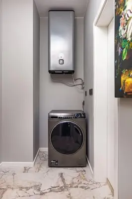 a small tv in a corner of a room at Apollo Apartment close to Medical University in Plovdiv
