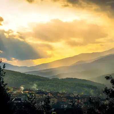 a view of a city with mountains in the background at Апартамент Веирас in Velingrad
