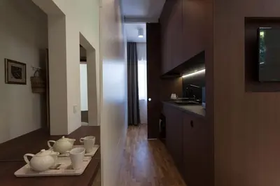 a kitchen with a table with cups and dishes on it at Gorgeous apartment in the perfect area in Sofia