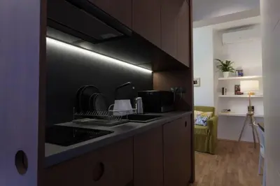 a kitchen with a sink and a stove top oven at Gorgeous apartment in the perfect area in Sofia