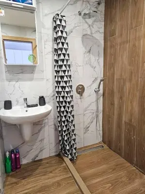 a bathroom with a sink and a shower at Boutique Studio B37 in Borovets